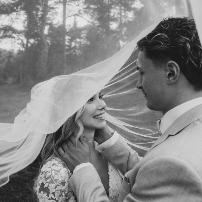 intimate bridal veil moment black and white wedding portrait