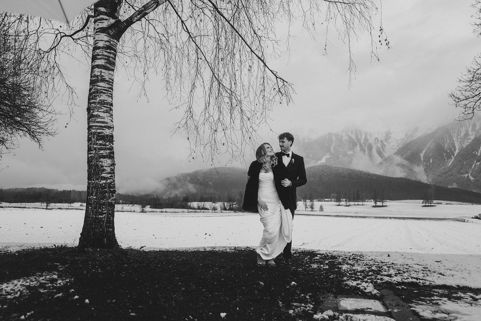 couple at alpine destination wedding with mountain scenery