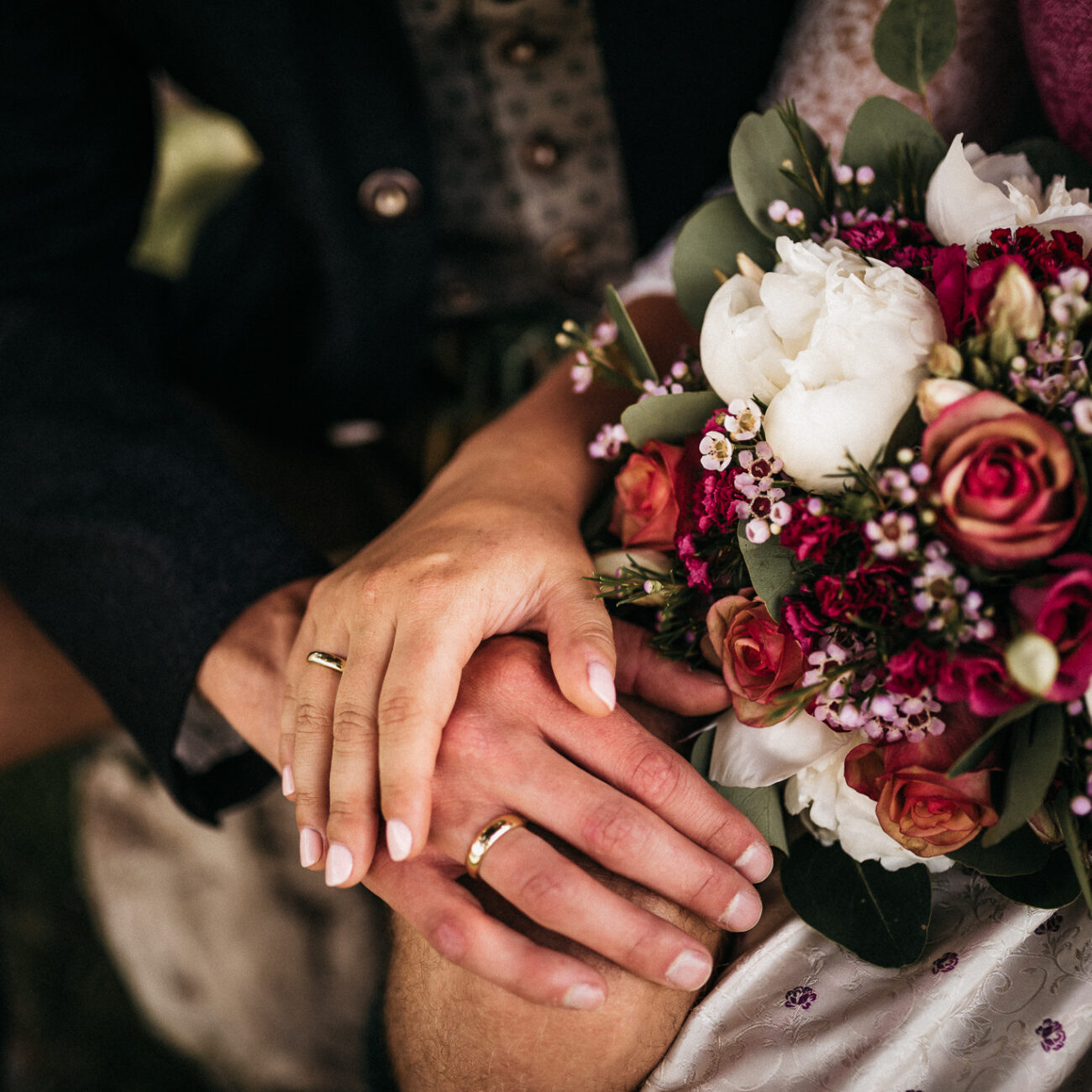 hands holding bridal bouquet intimate wedding moment