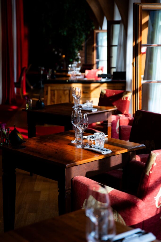 Elegant dining area at Schloss Elmau with warm lighting and refined alpine atmosphere