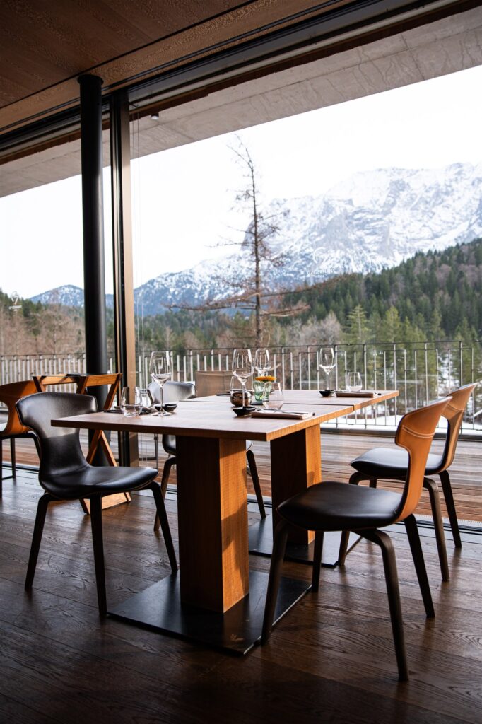 Schloss Elmau dining space, known as the G7 summit location, with panoramic views of the Bavarian Alps