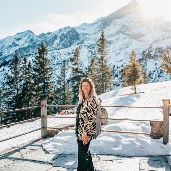 Wedding planner Angelika from AWIKA Weddings at an Alpine wedding location with mountain view