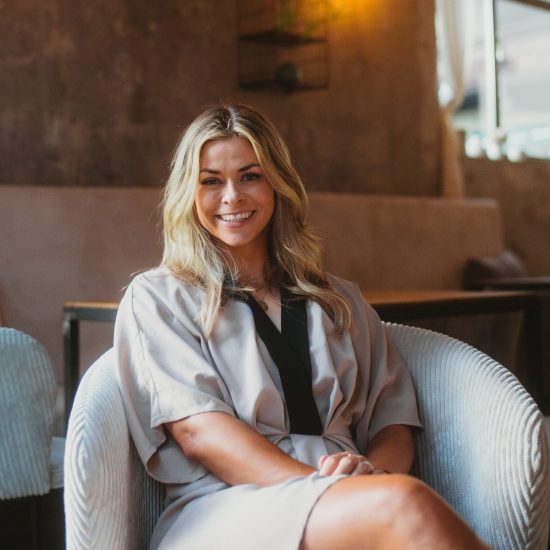 Portrait of wedding planner from AWIKA WEDDINGS in Garmisch looking into the camera — friendly and professional impression.